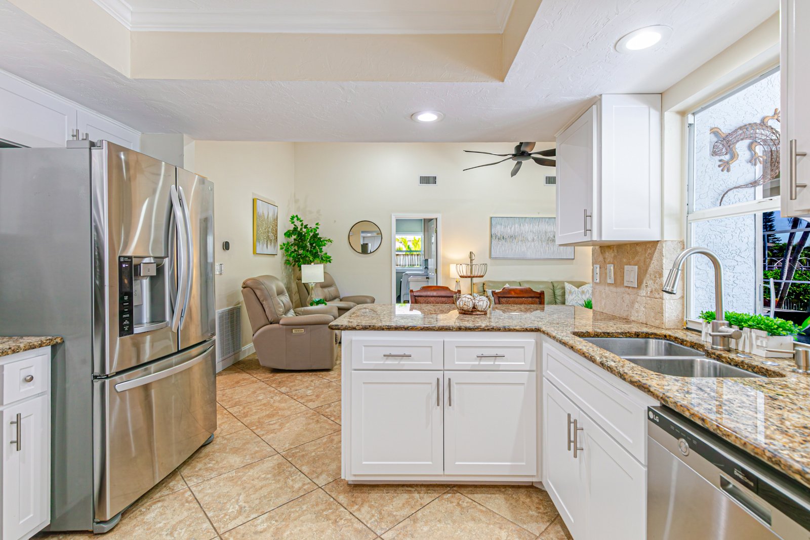 Kitchen with white cabinets, granite counters and stainless appliances at 2828 SW 36th St, Cape Coral FL Kitchen with white cabinets, granite counters and stainless appliances at 2828 SW 36th St, Cape Coral FL