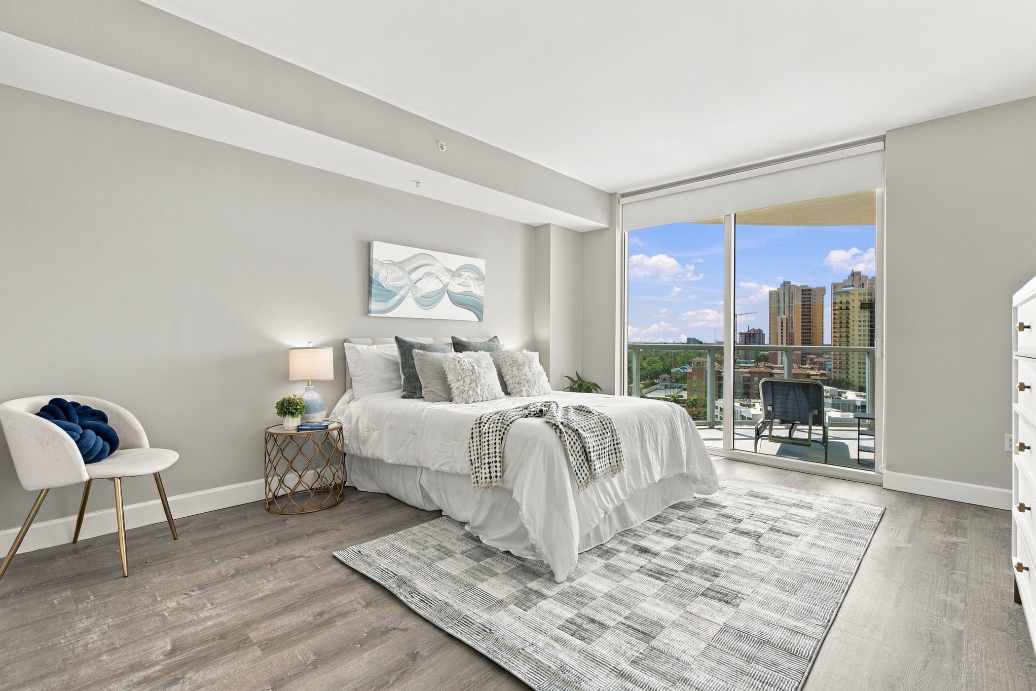 Primary bedroom with river and city views at 3000 Oasis Grand Blvd #1401, Fort Myers FL