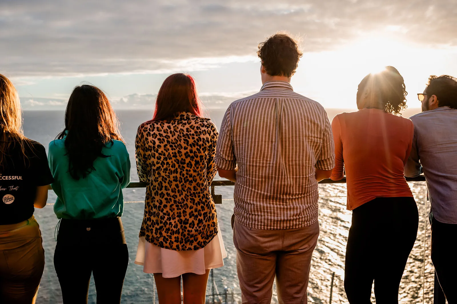 Founders watching the sunset over the Atlantic from a terrace