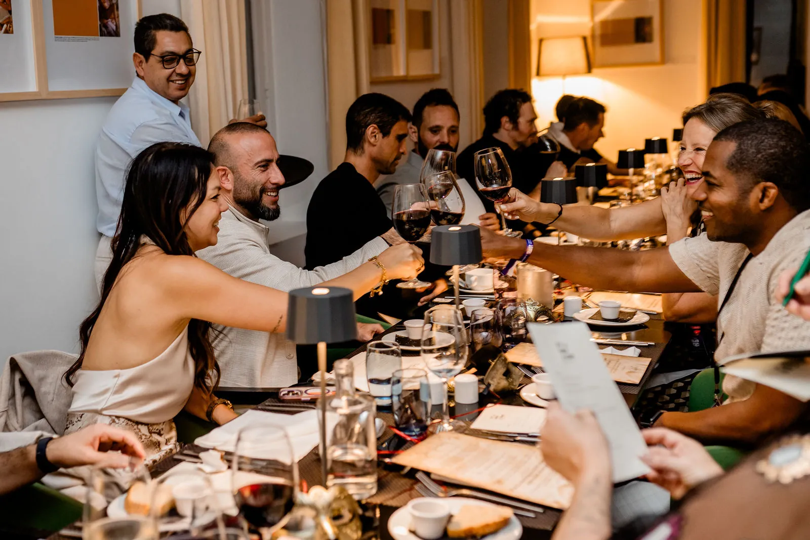 Founders sharing a long-table network dinner