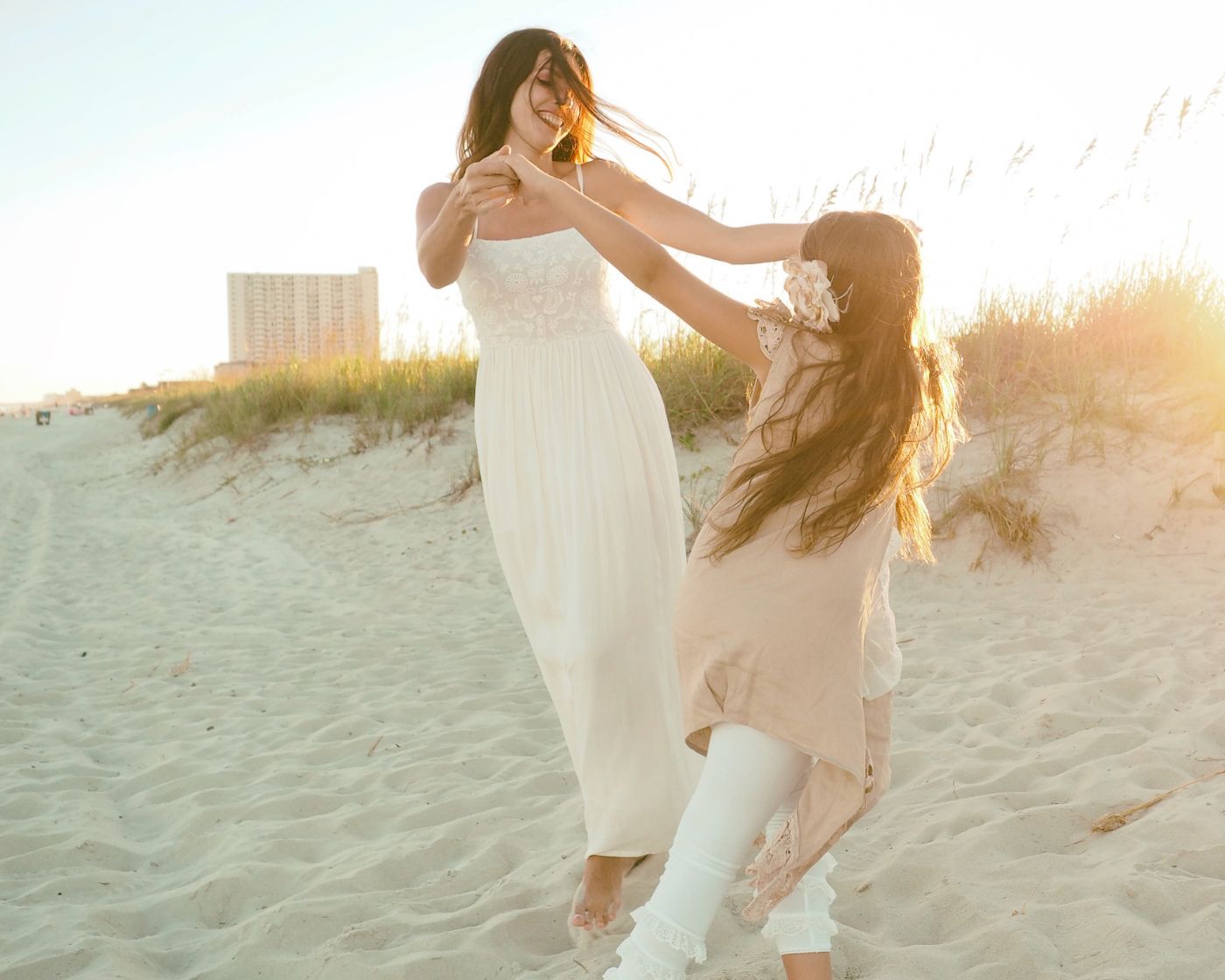 Mother and daughter sharing a joyful moment together outdoors