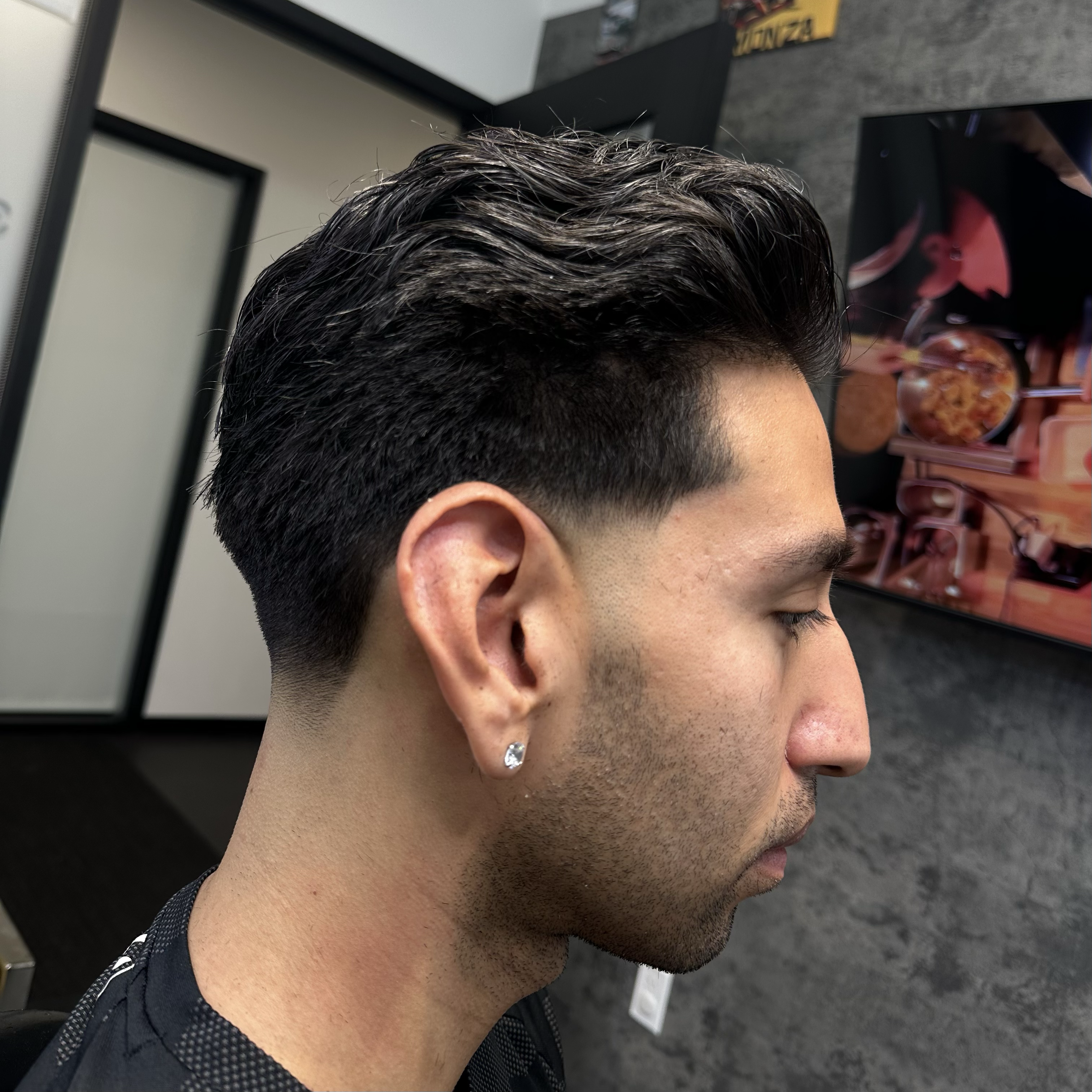 mid fade with line up by barber Alexis Rivera at Blacklaces in West Hollywood, Los Angeles