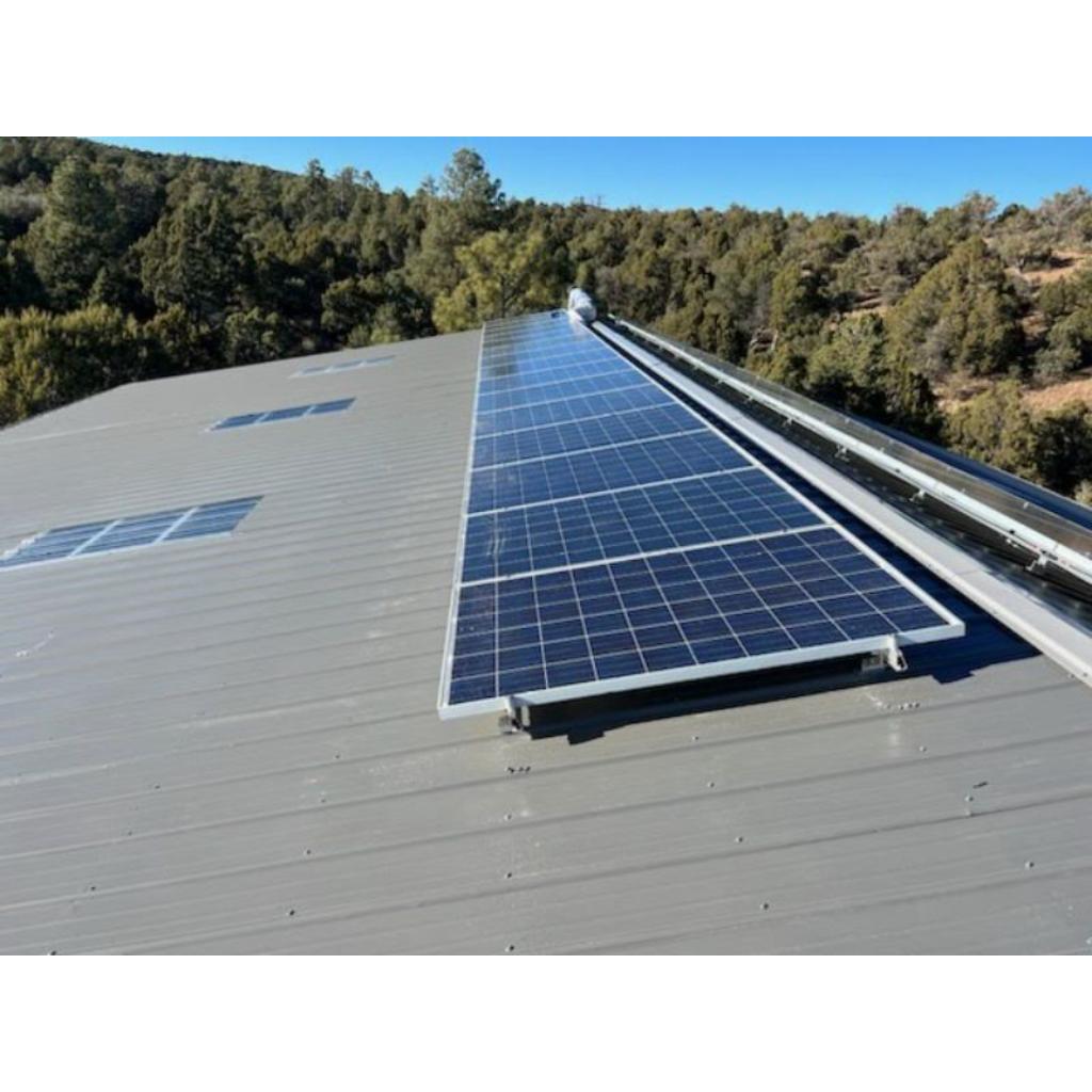 Solar panels on a metal roof installed by White Mountains Solar in the Arizona White Mountains