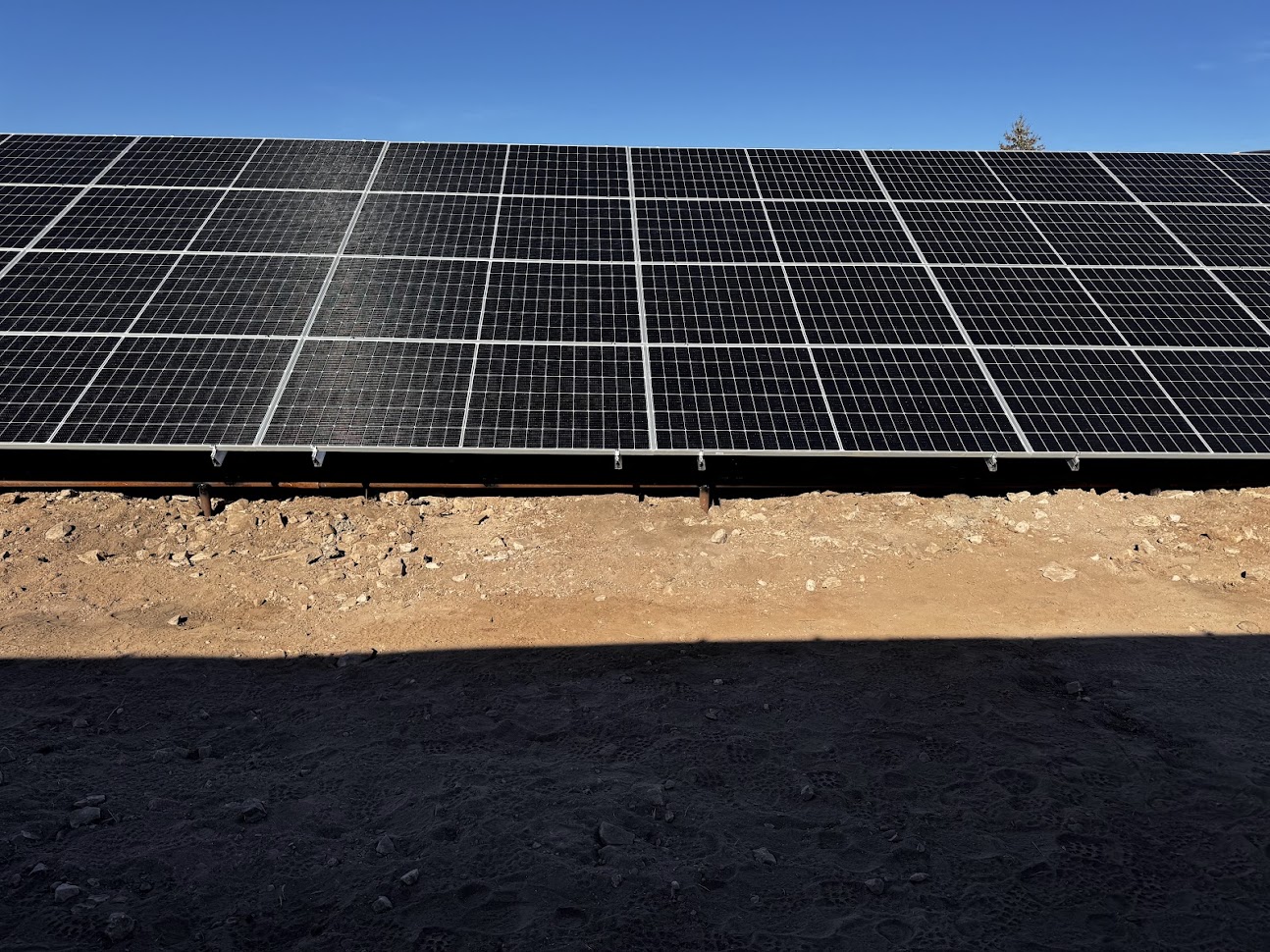 Large ground-mount solar panel array installed by White Mountains Solar in Arizona