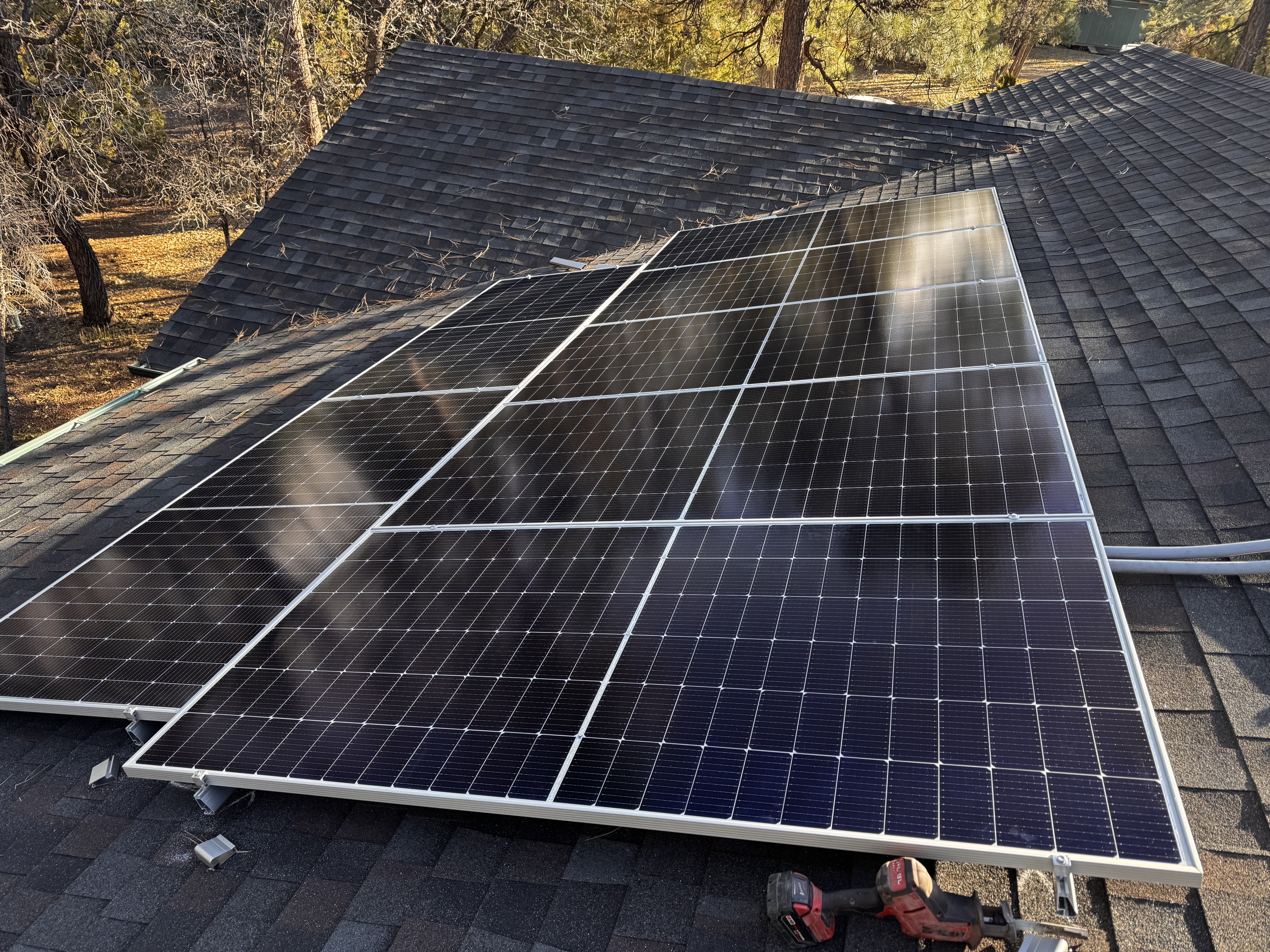 White Mountains Solar rooftop installation Show Low Arizona home with pine trees