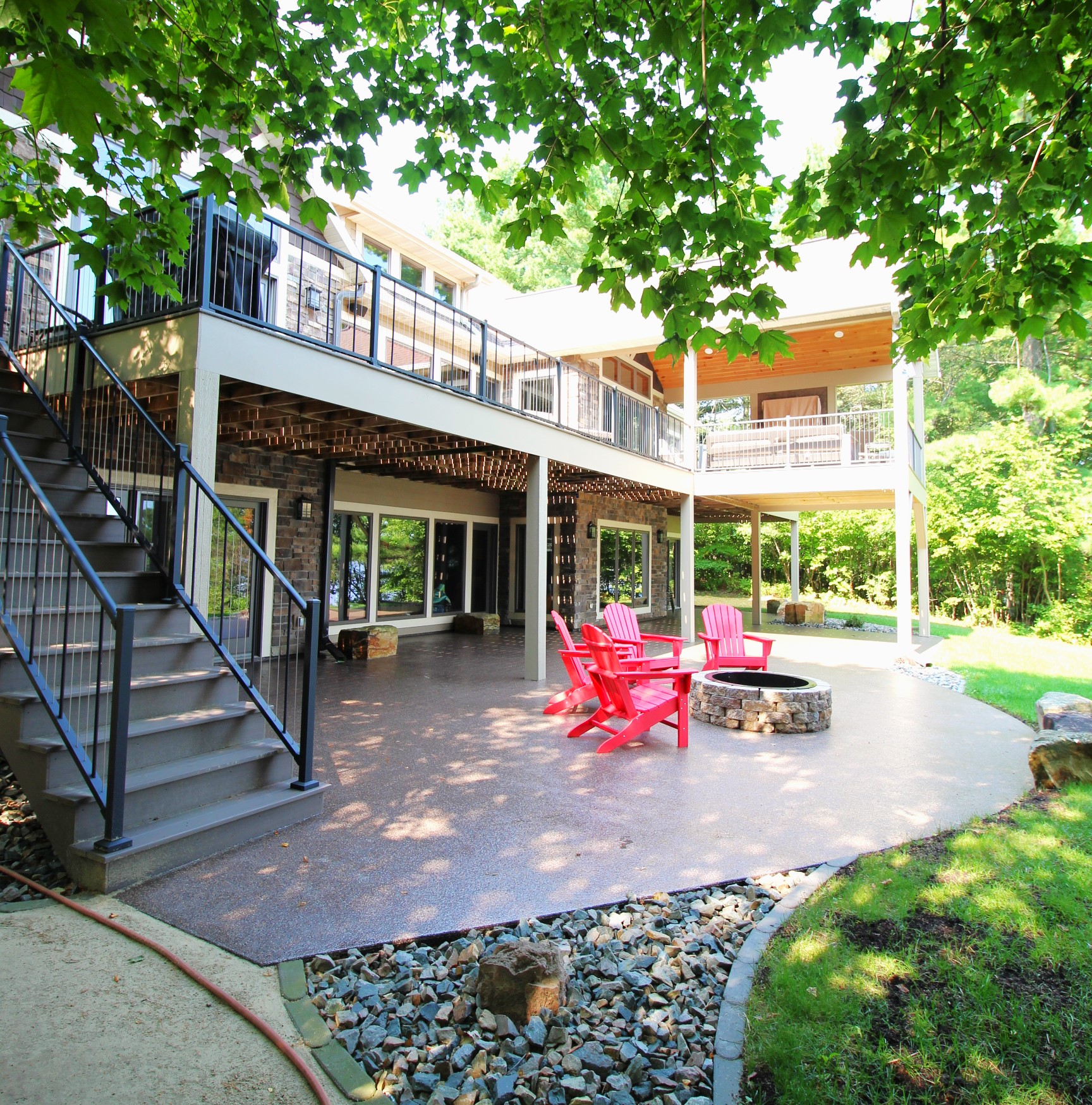 Colored stamped concrete patio with fire pit in Wausau, WI