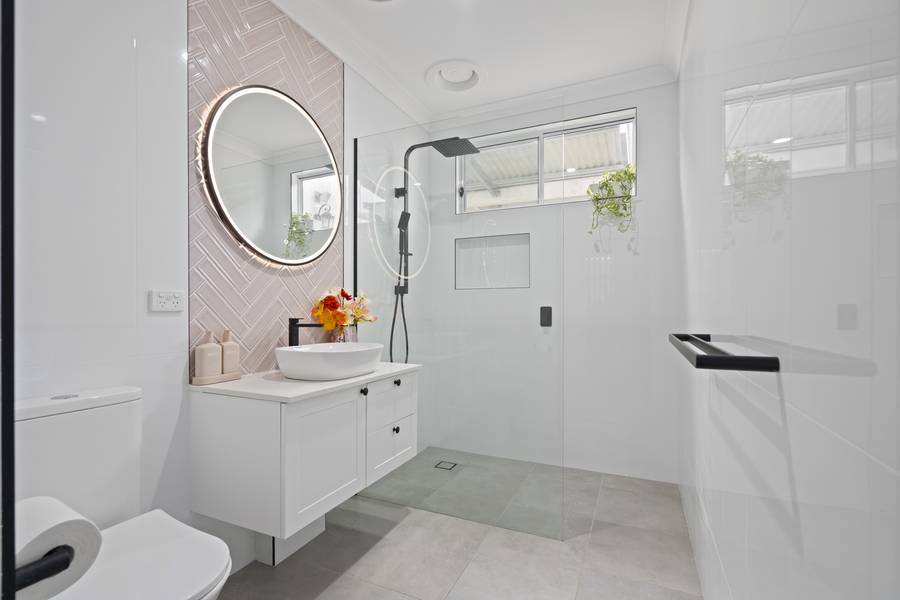 Bathroom with feature tile wall and walk-in shower