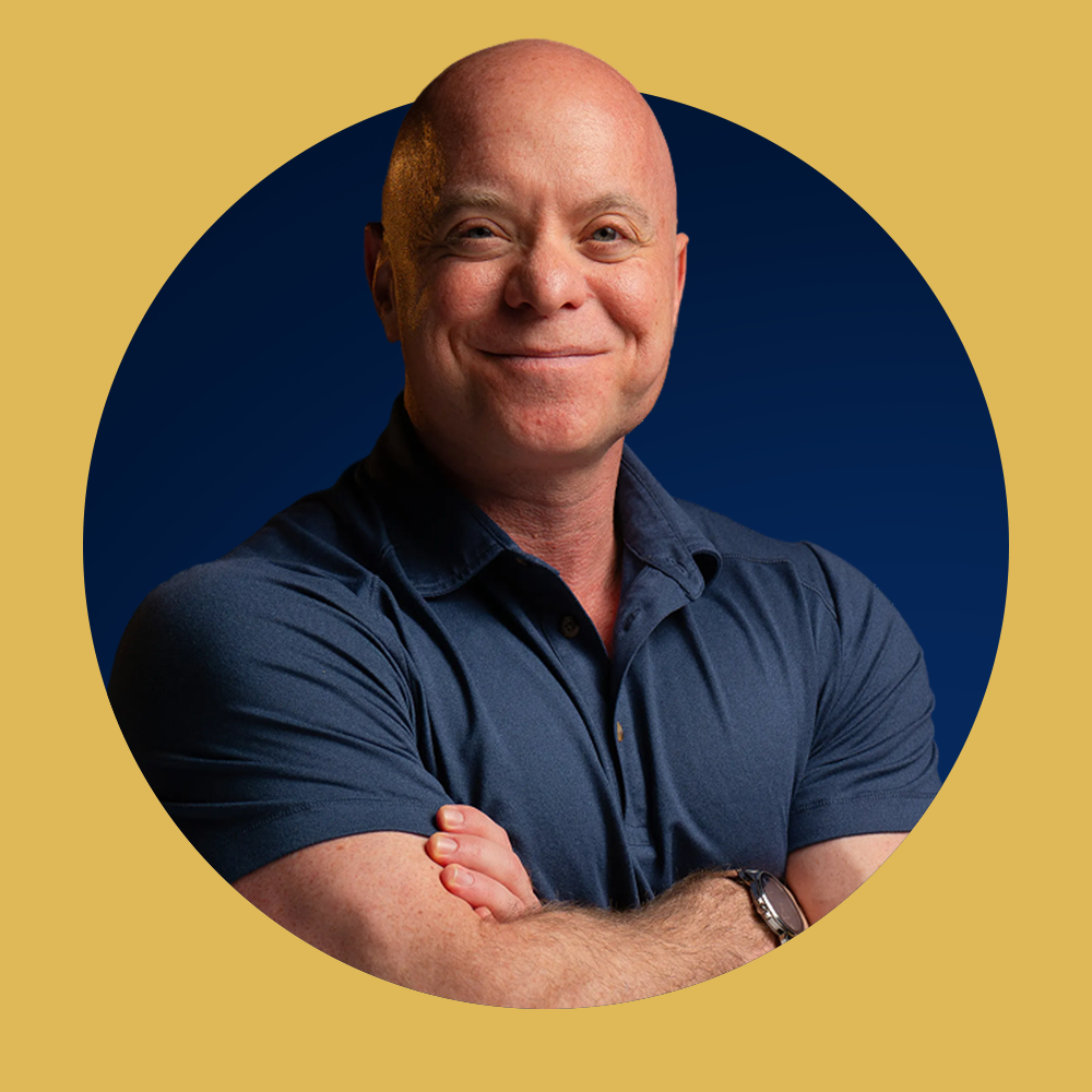 Rob Stein smiling in a navy polo, framed by a gold ring