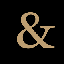 Inch & Co. logo featuring a gold ampersand on a black background
