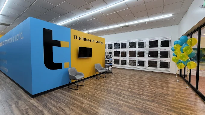 The TrueRoof showroom interior with seating and sample displays