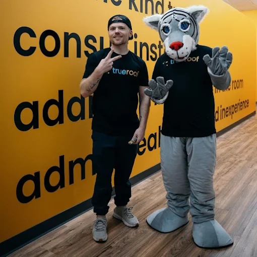 Matt with the TrueRoof mascot at the showroom