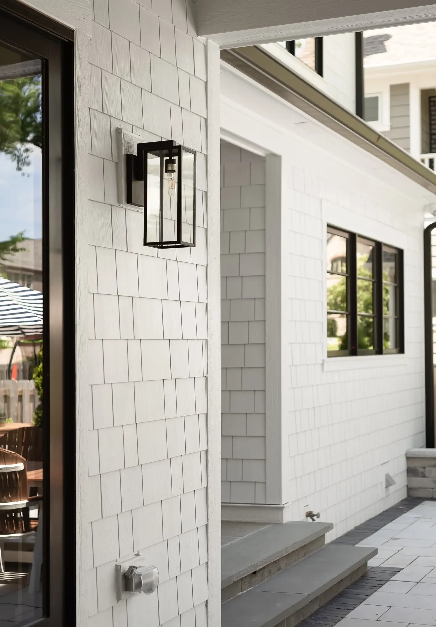 Shake-style James Hardie siding finish reference with white trim and black windows