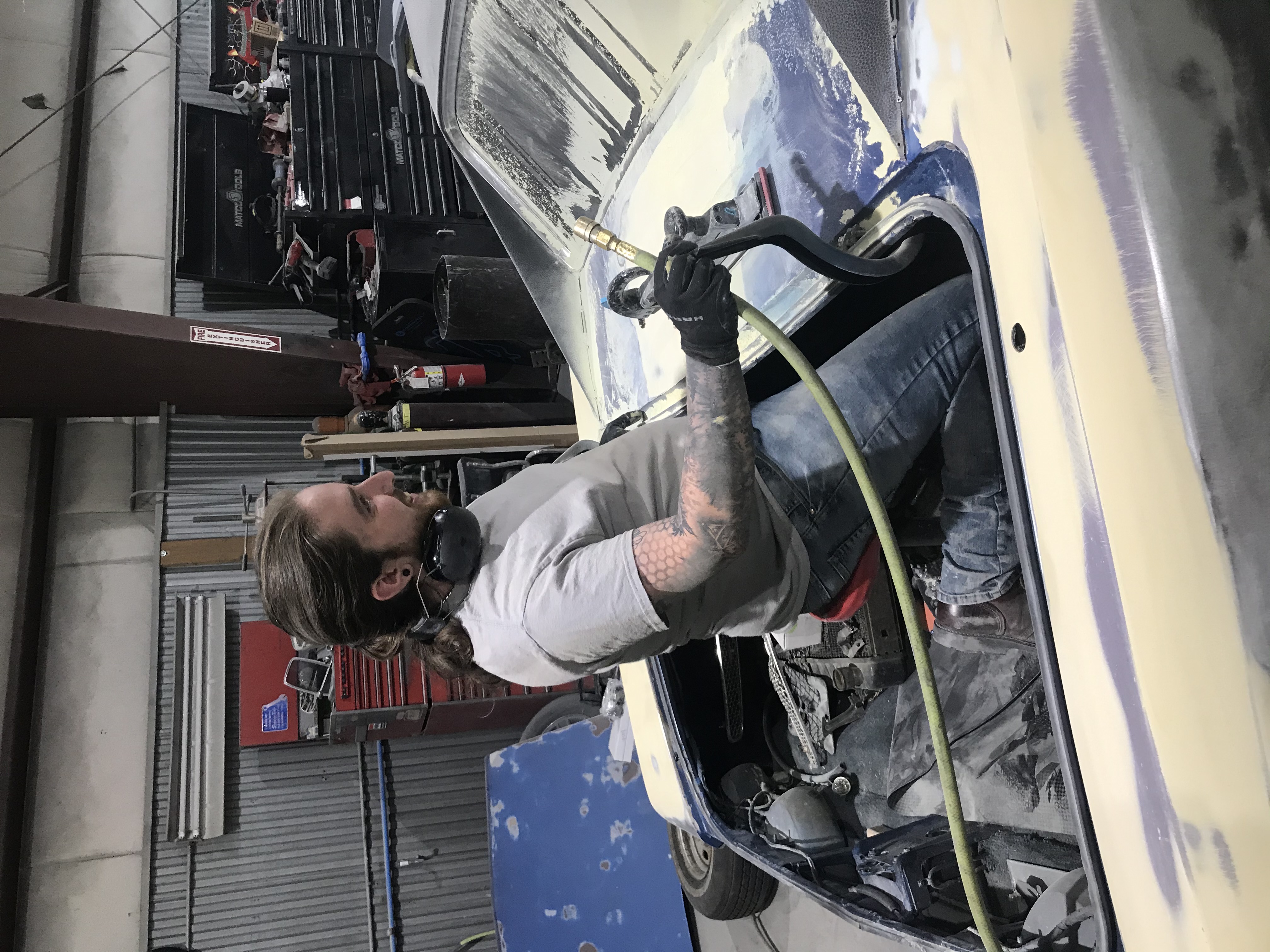 Employee painting car