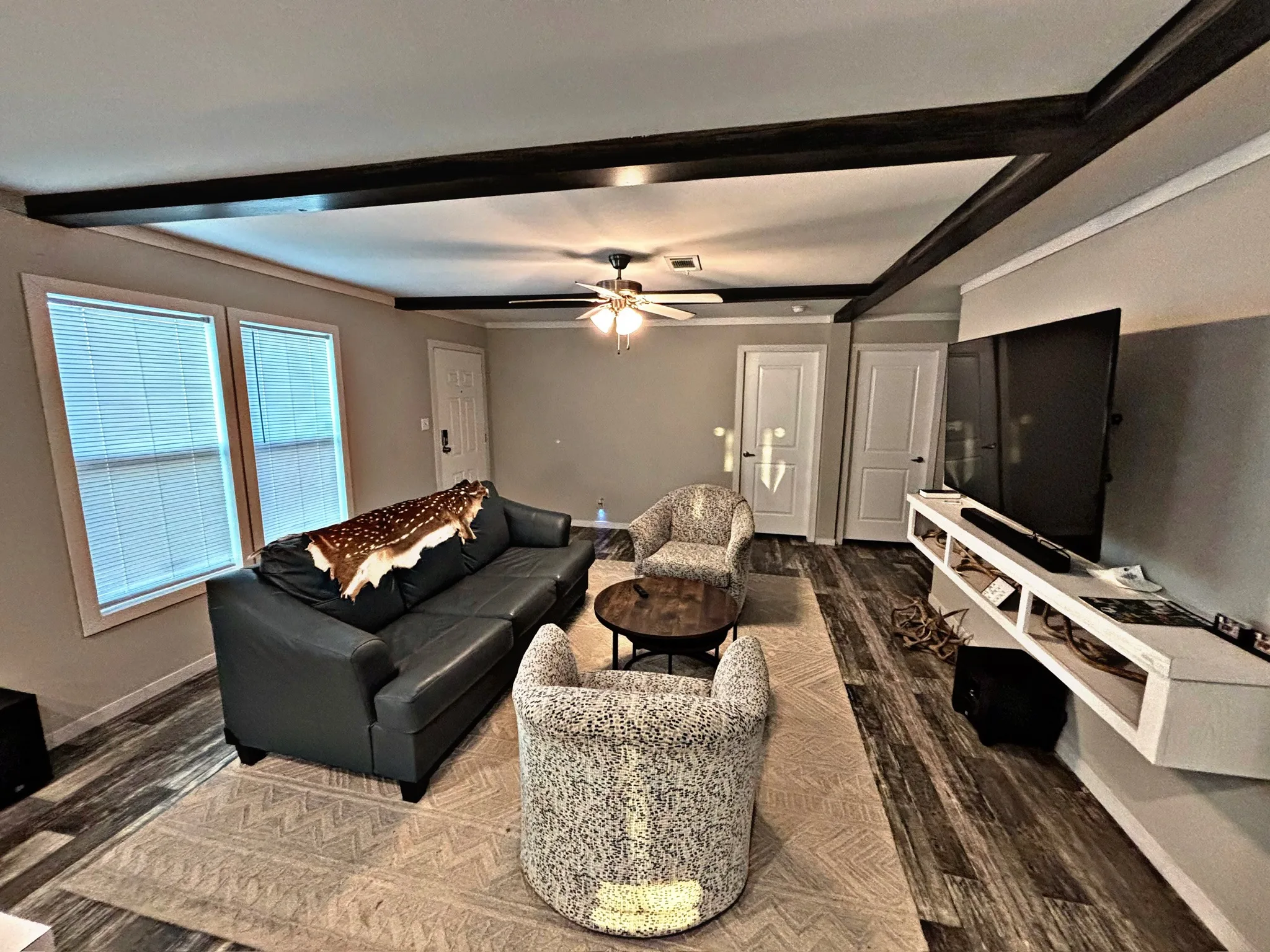 Comfortable living room in the Five Aces Ranch hunting lodge, Millersview TX
