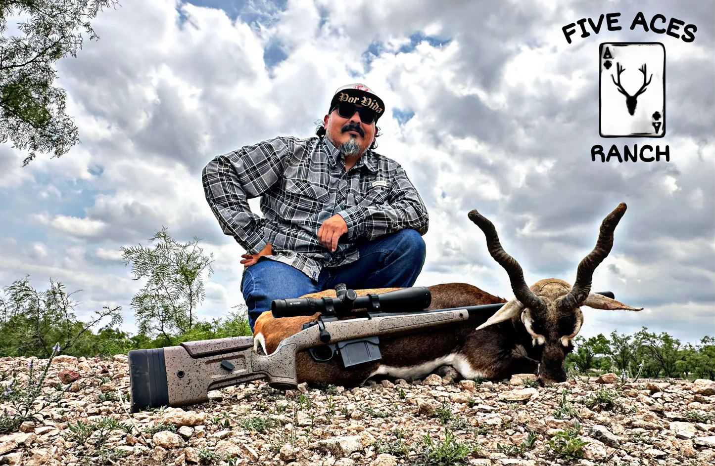 Hunter with trophy red sheep harvested at Five Aces Ranch in Millersview, TX.