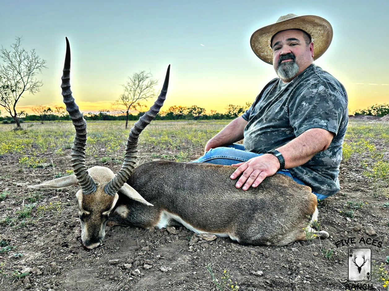 Hunter with trophy scimitar oryx harvested at Five Aces Ranch in Millersview, TX.
