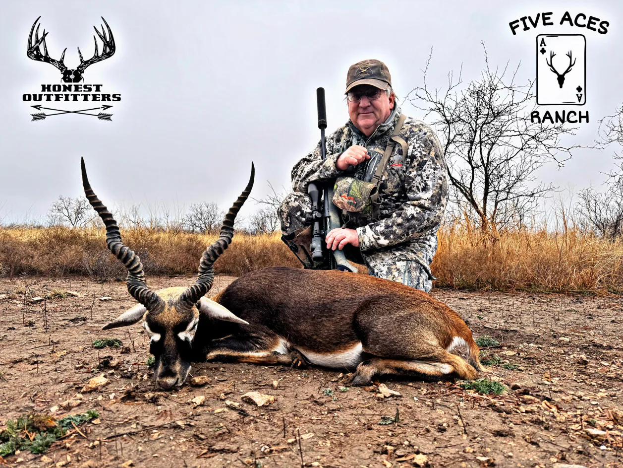 Hunter with trophy fallow deer harvested at Five Aces Ranch in Millersview, TX.