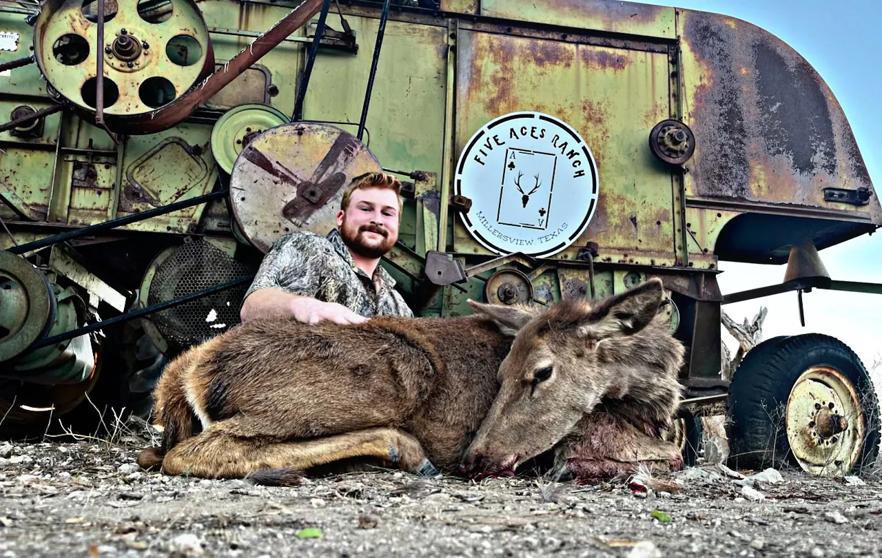 Hunter with trophy axis deer at Five Aces Ranch in Concho County, TX