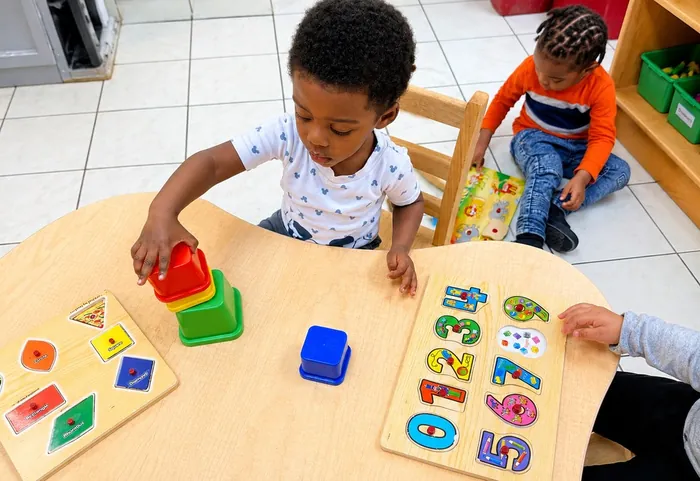 Toddler hands-on shape-sorting activity at François Academy
