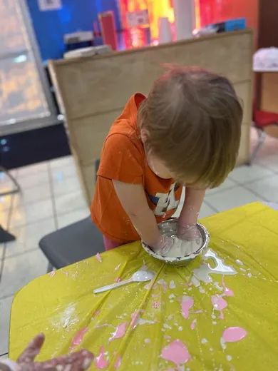 Children in safety goggles exploring a hands-on experiment