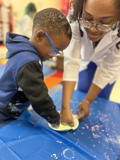 A child engaged in a creative activity