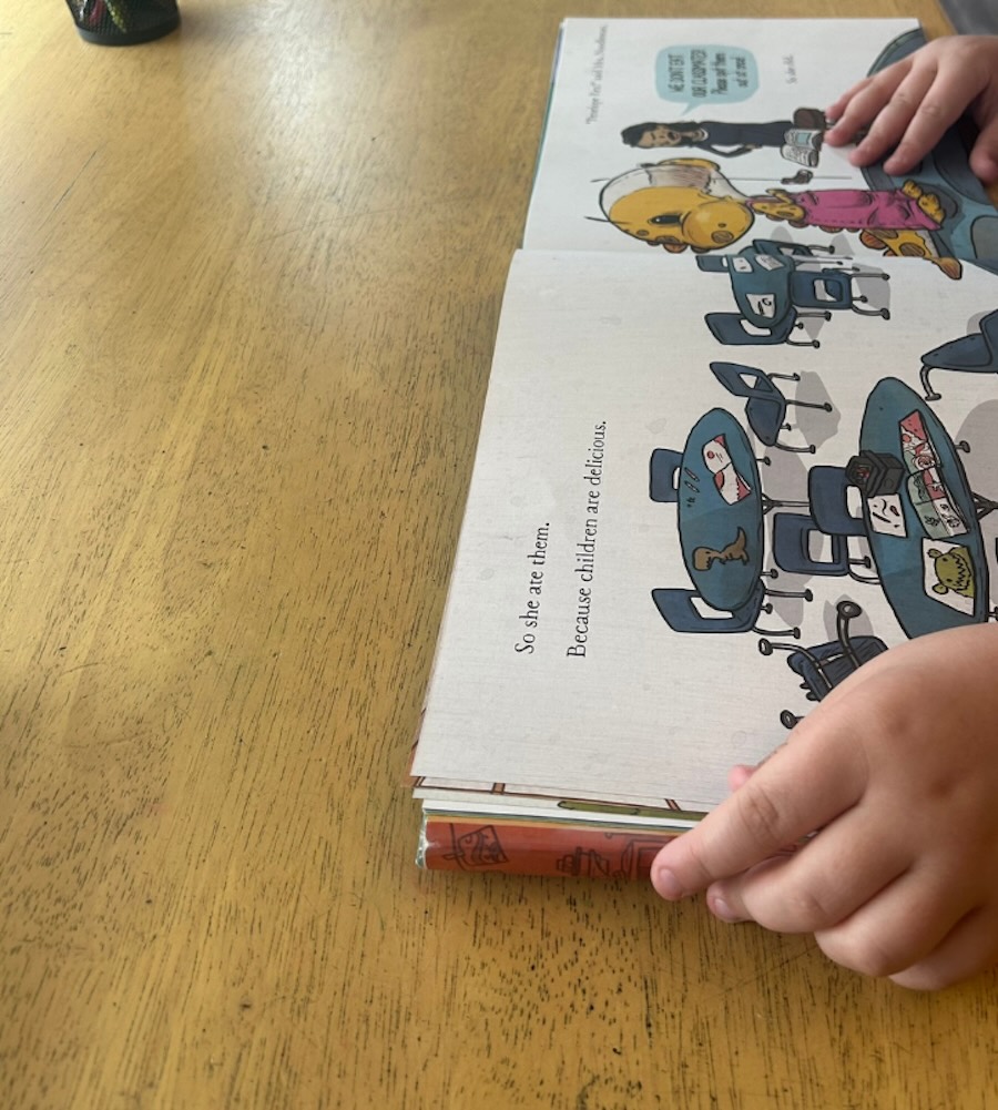 Student reading a decodable book during a personalized reading intervention lesson