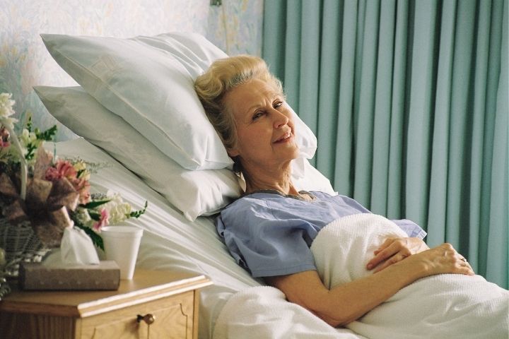 A patient resting comfortably at home, showing the benefits of adjustable Hospital beds.
