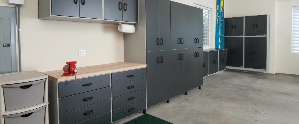 Garage storage cabinets and workbench setup for home organization.