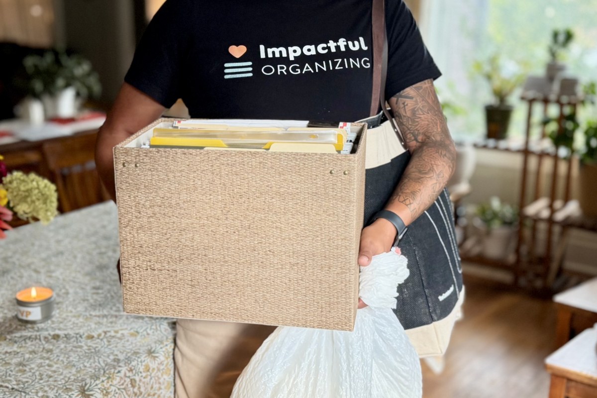 An Impactful Organizing organizer carrying a sorted file box and a bag to toss