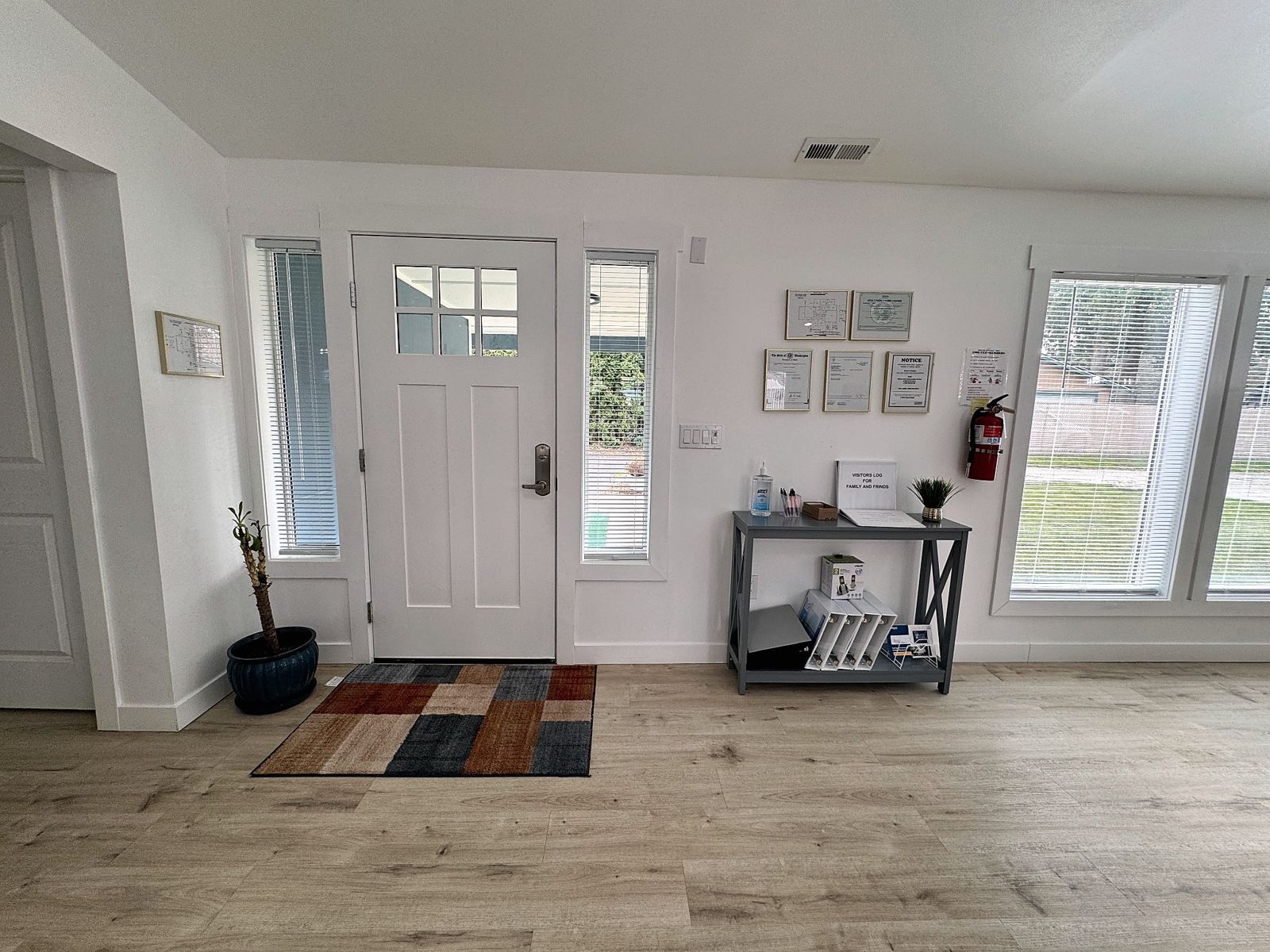 Front entry with visitor log and posted state licenses