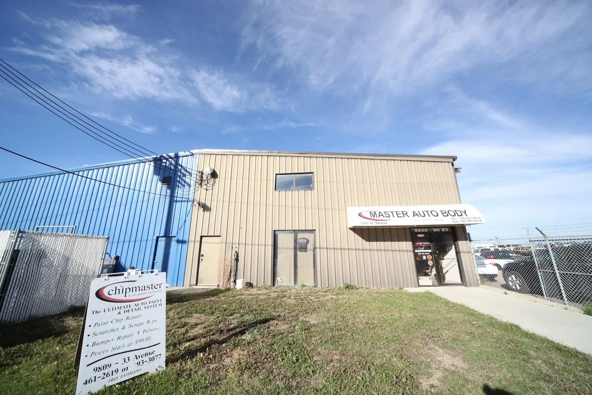 Front entrance and customer parking at Master Auto Body