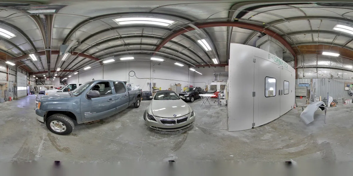 Vehicles in the work bays at Master Auto Body