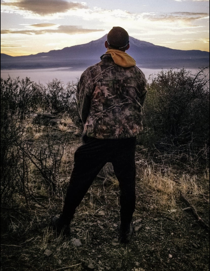 Solitary moment facing the mountain