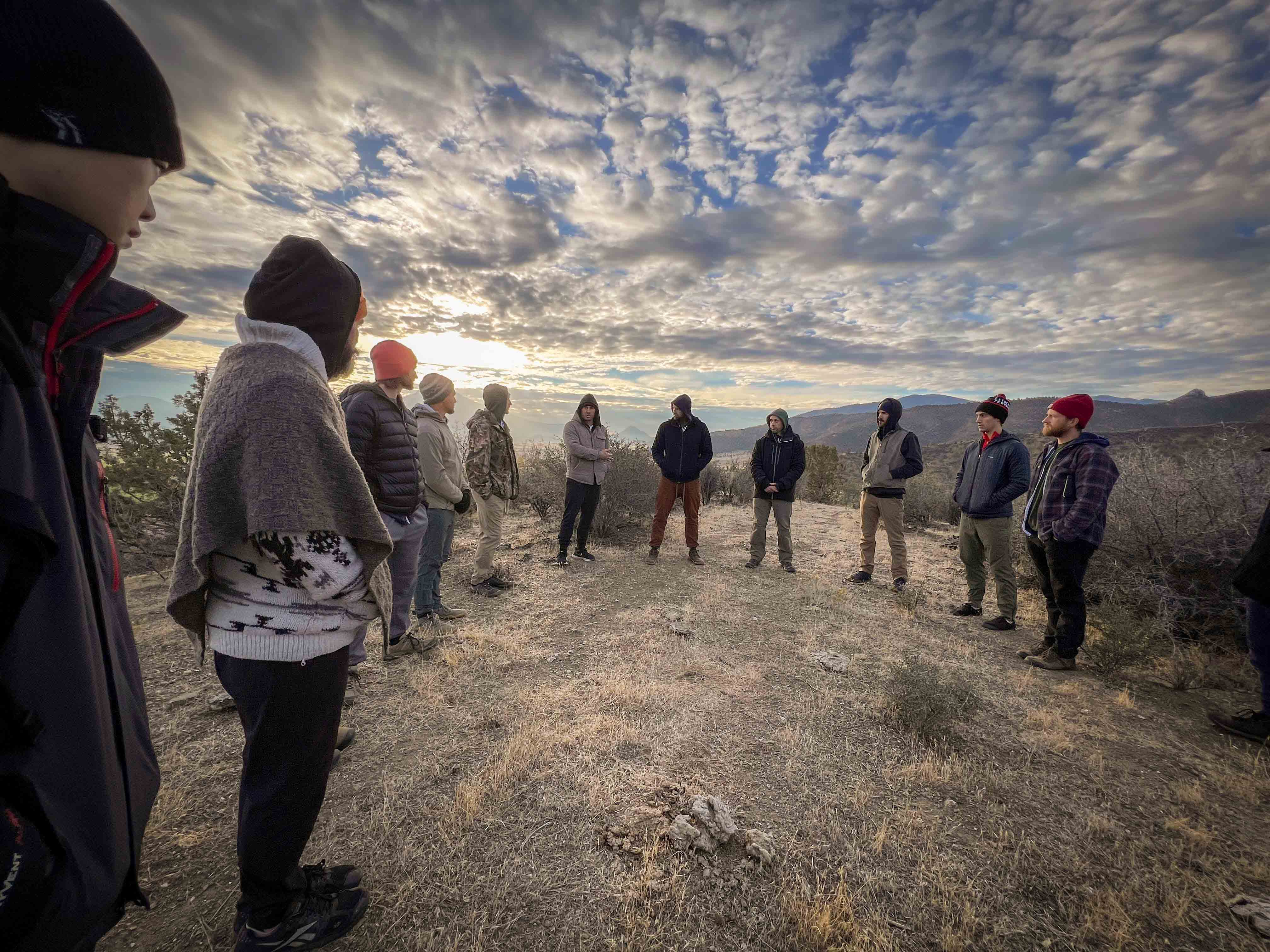 Men in circle on the mountain