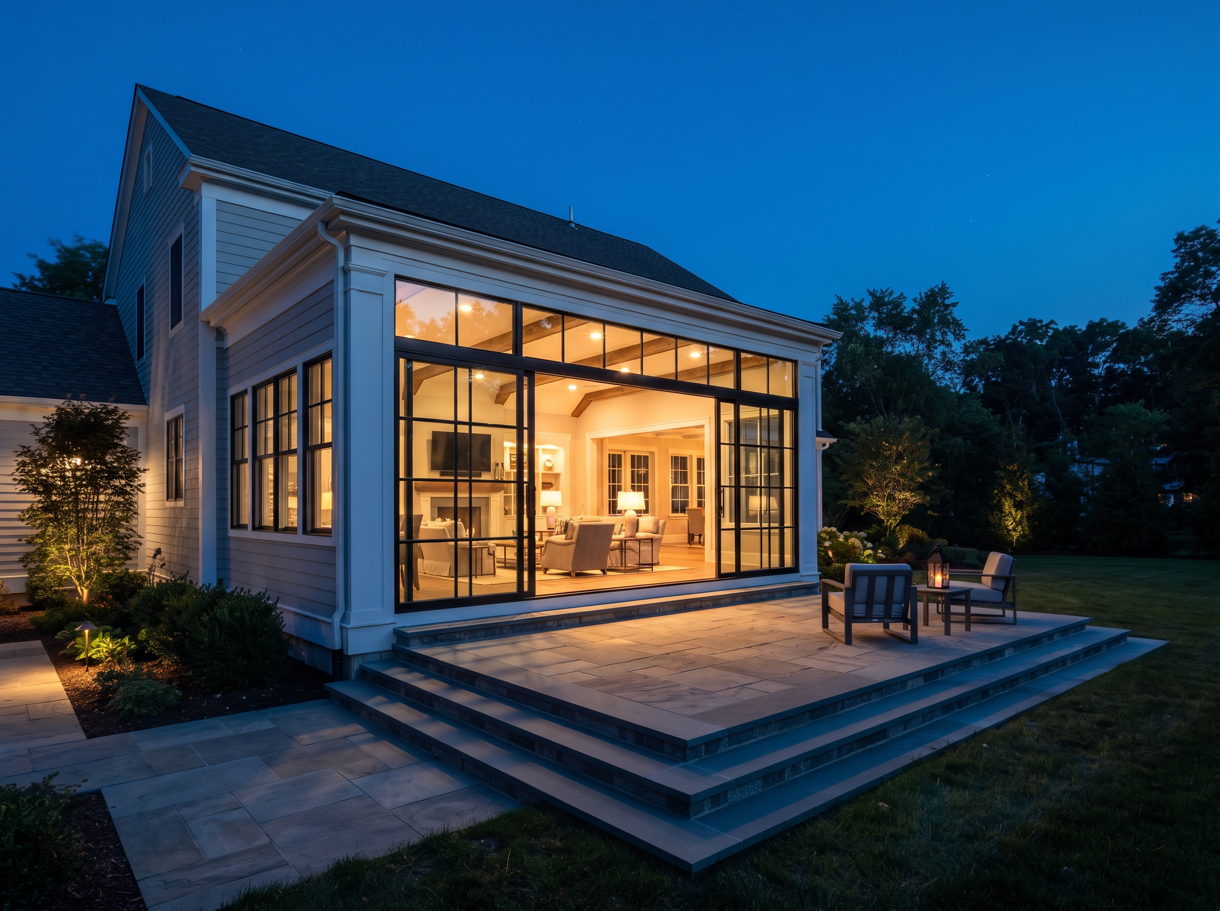 Two-story great-room home addition at dusk