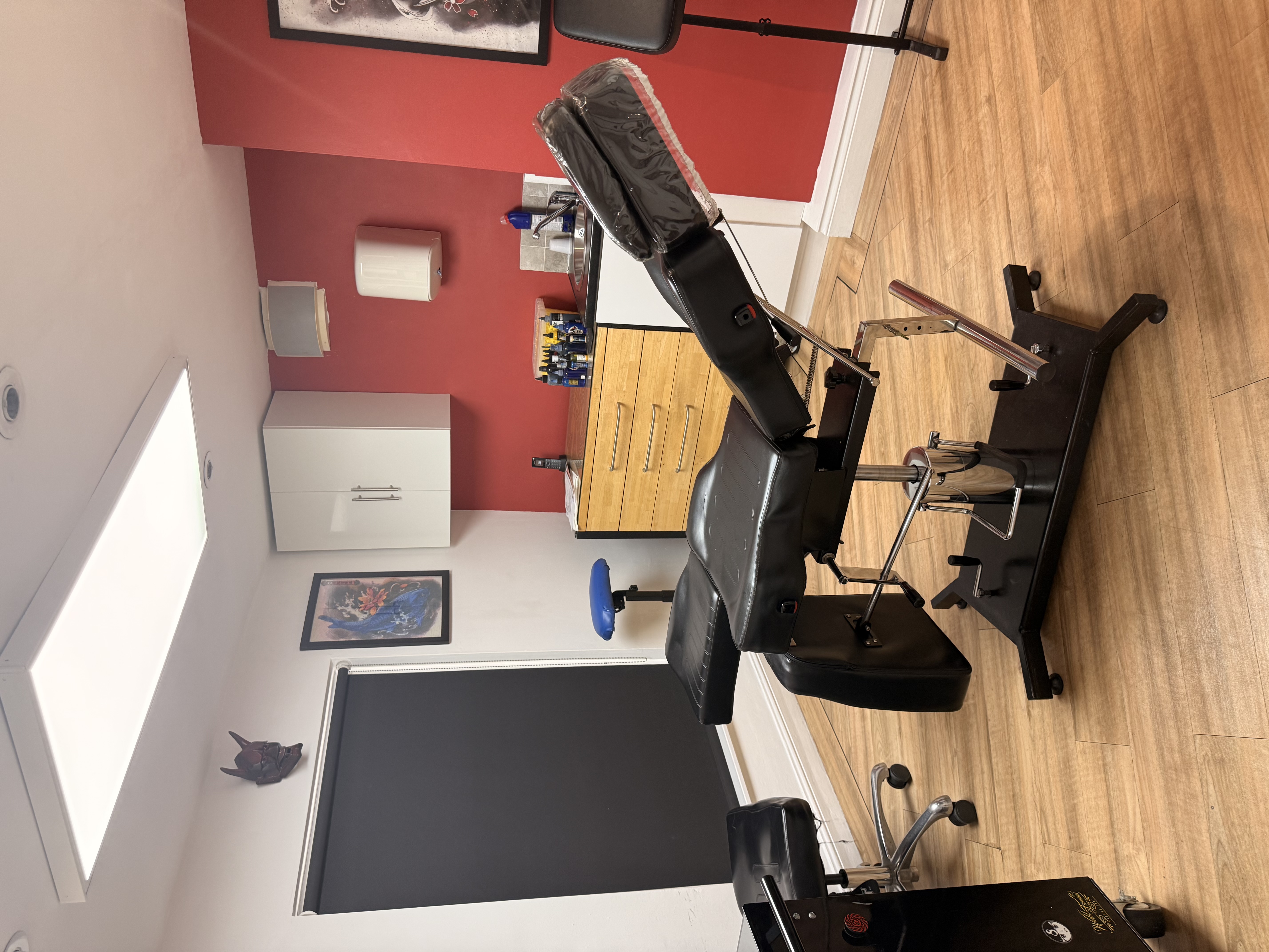 Red treatment room inside Tattoo Phil's