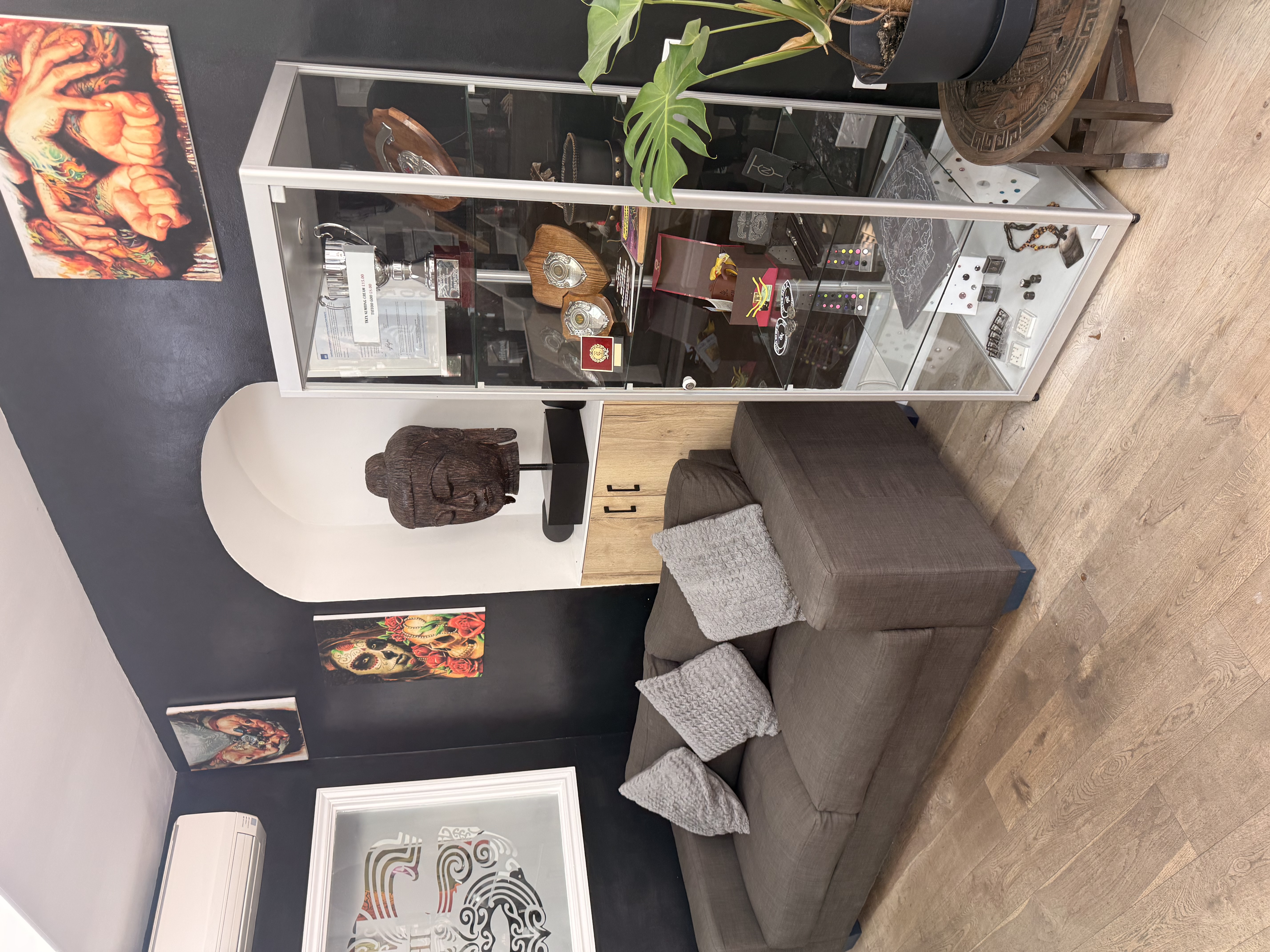 Studio seating and display cabinet at Tattoo Phil's