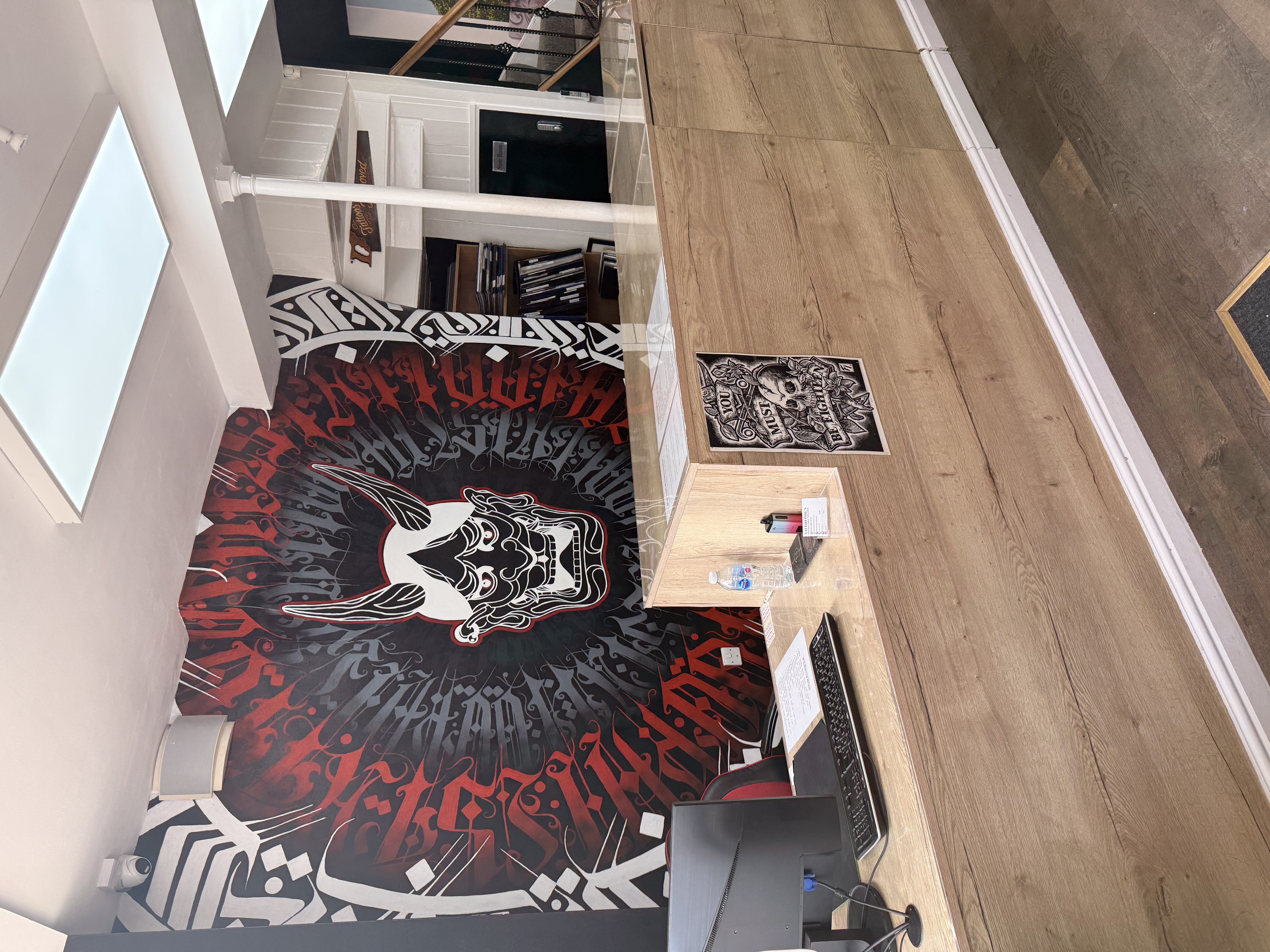 Reception desk and feature artwork inside Tattoo Phil's