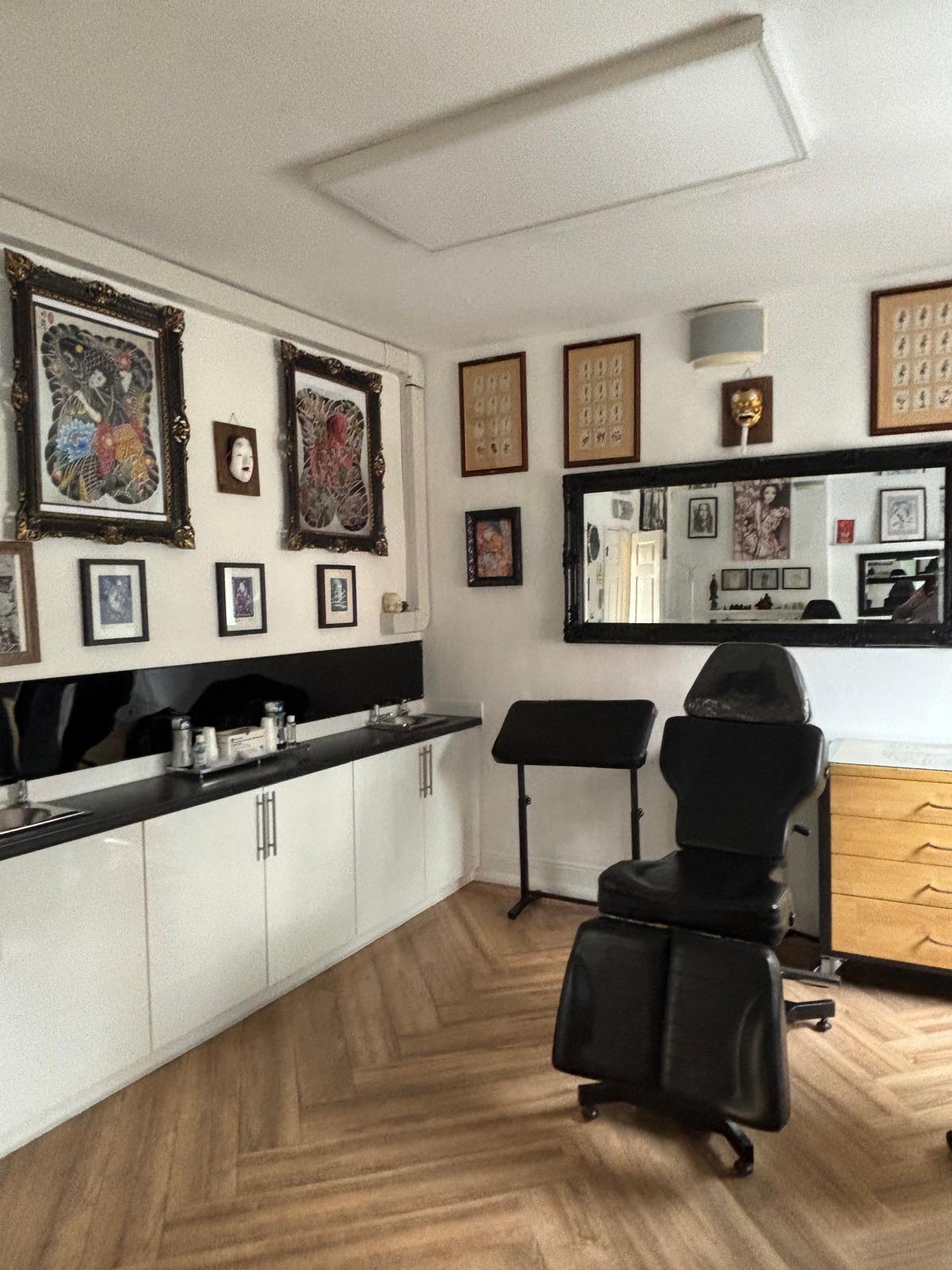 Tattoo treatment station and artwork inside Tattoo Phil's