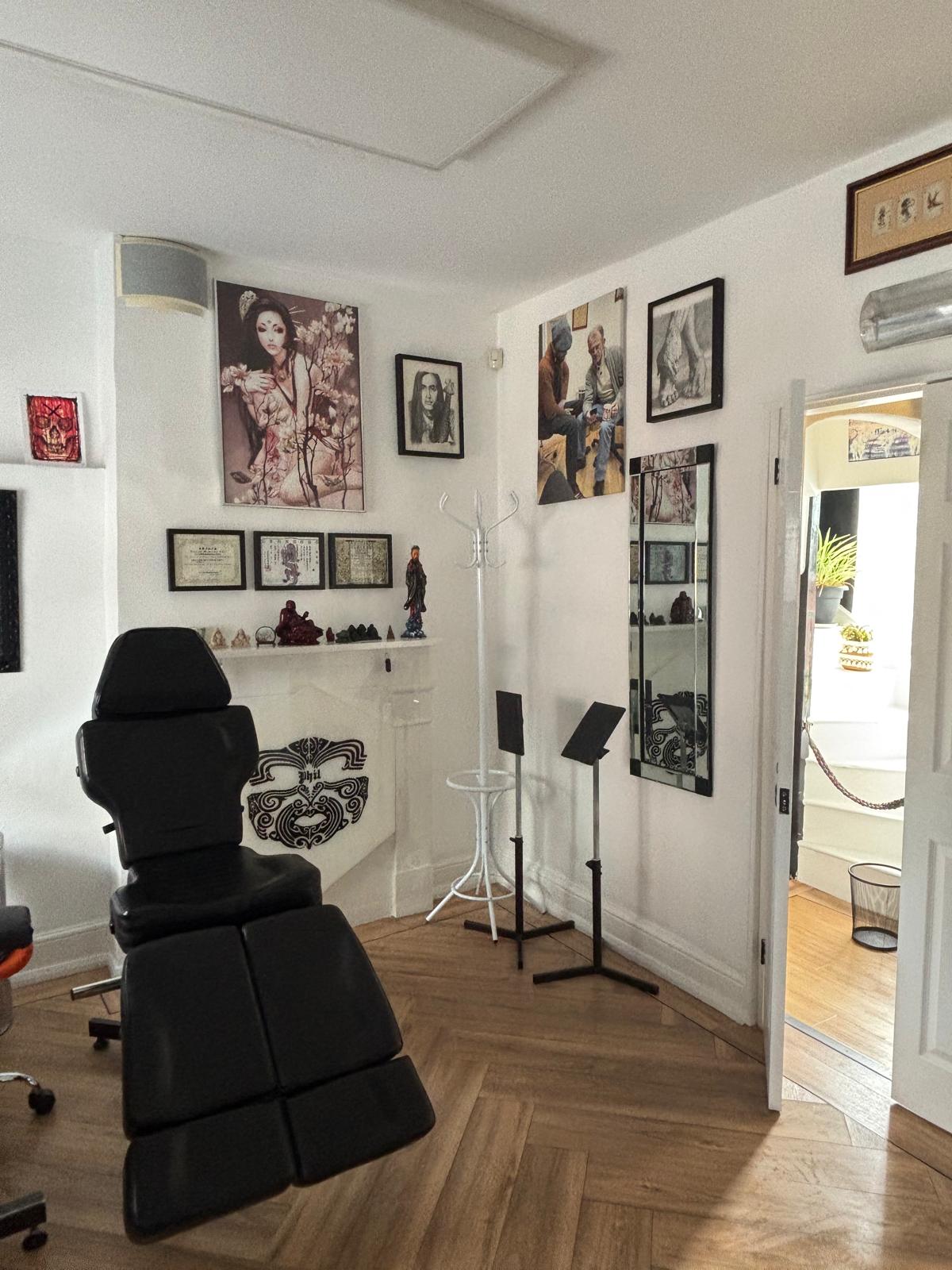 Bright treatment room inside Tattoo Phil's