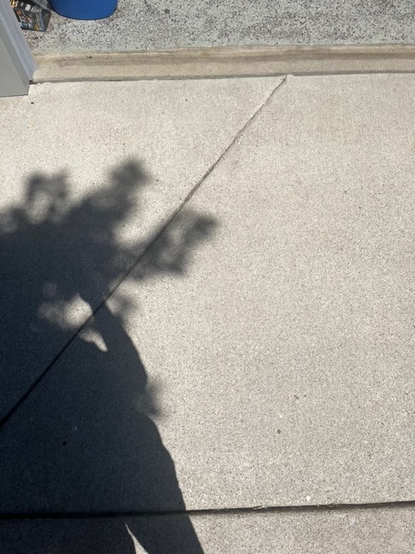 The same concrete after pressure washing, back to its original color