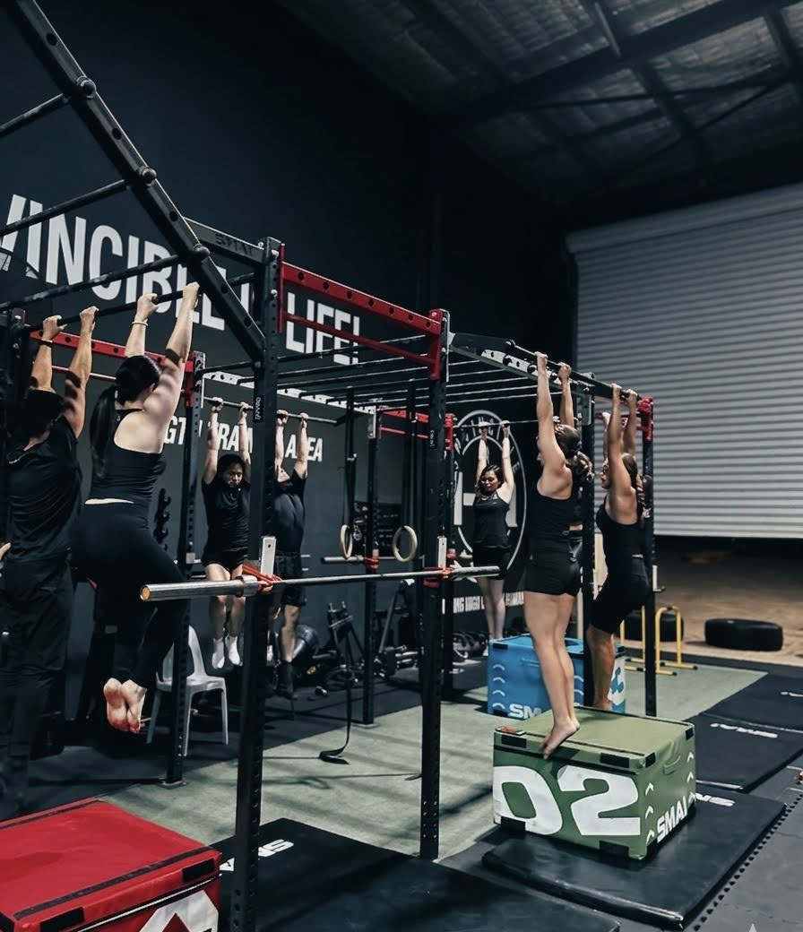 Alan La coaching strength training at Invincible HQ