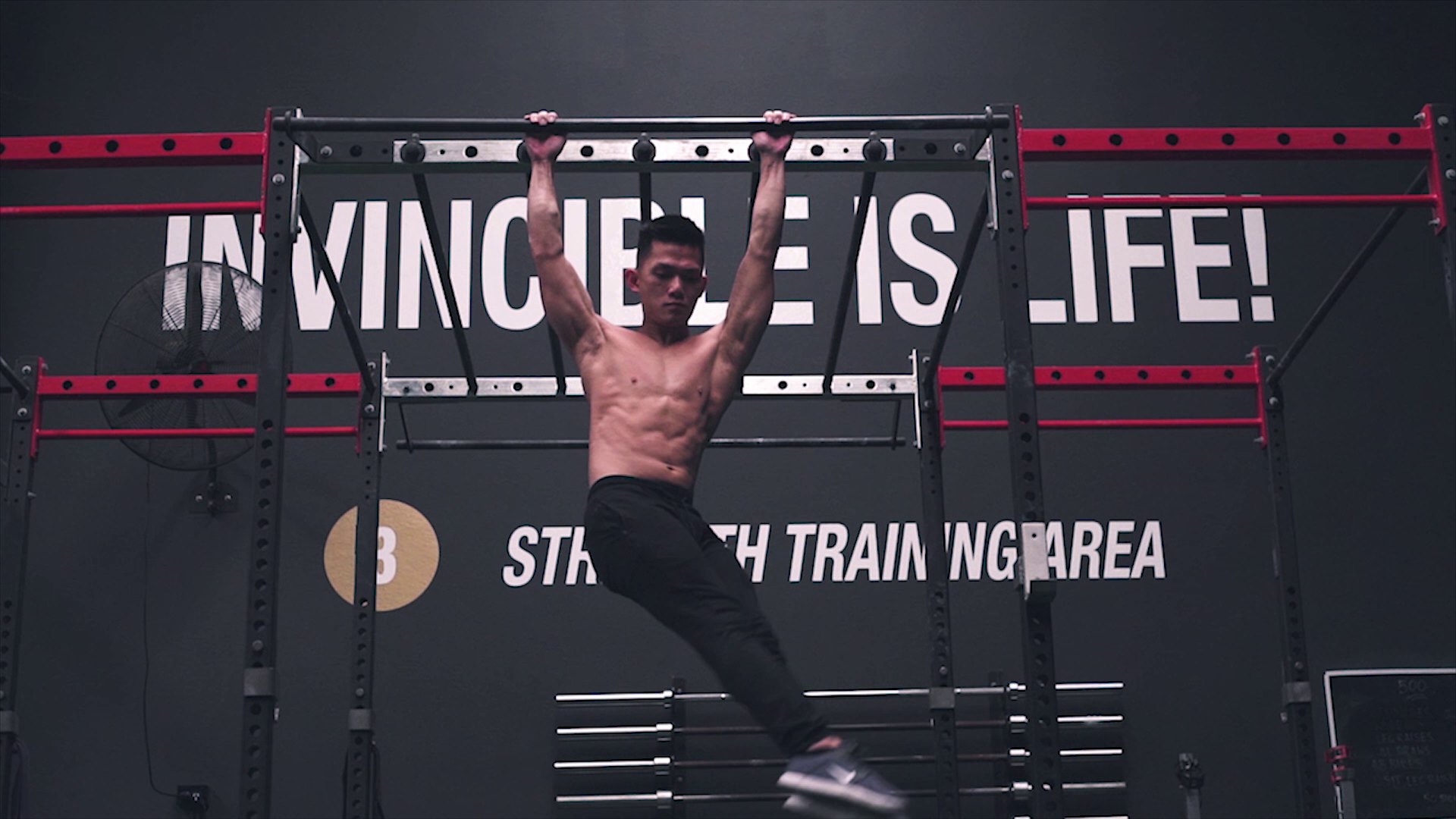Invincible athlete demonstrating core strength