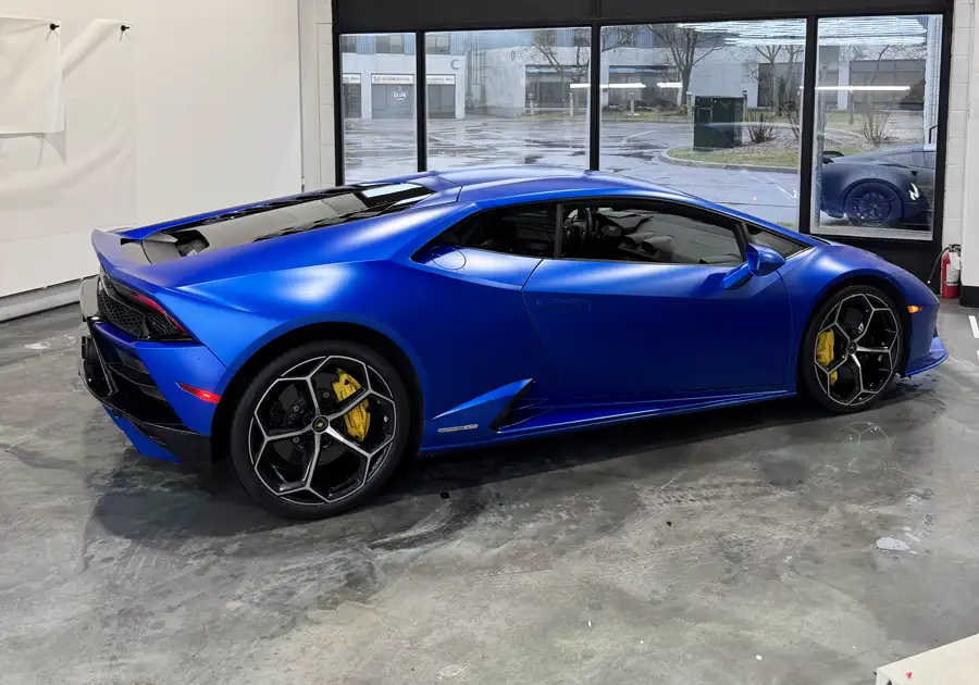 Satin blue Lamborghini Huracán in the AutoCore shop