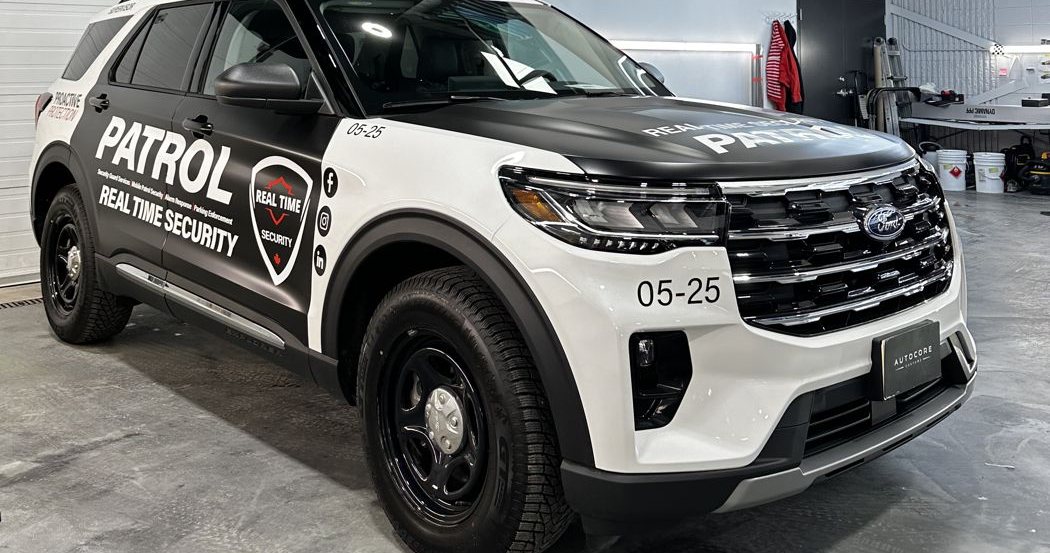 Partial wrap on a patrol Ford Explorer, side view