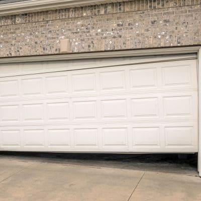 White automatic garage door partially open