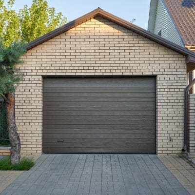 Contemporary brown garage door on a standalone garage