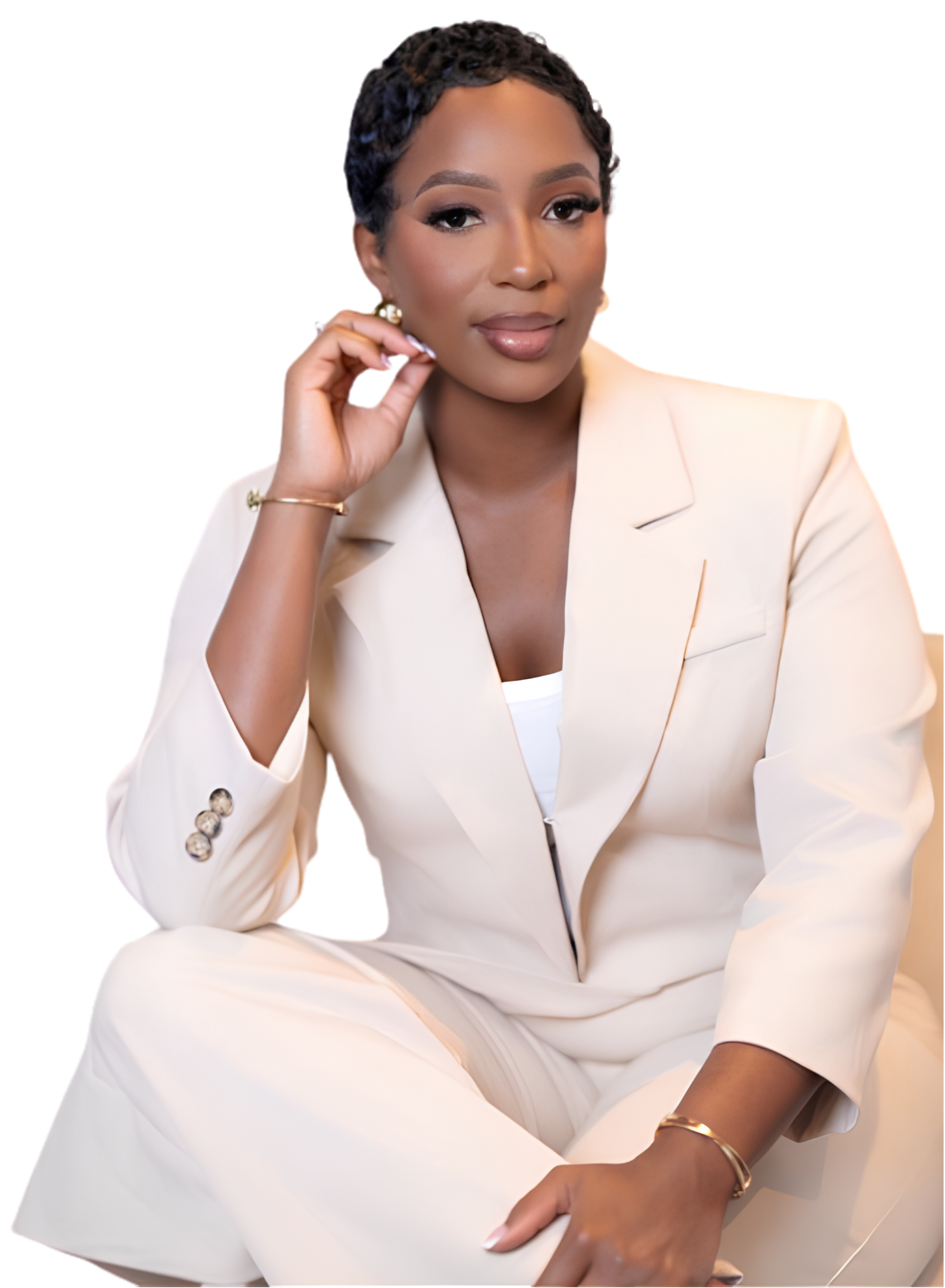 Danesha Williams-Gelin, Realtor, seated in a cream suit