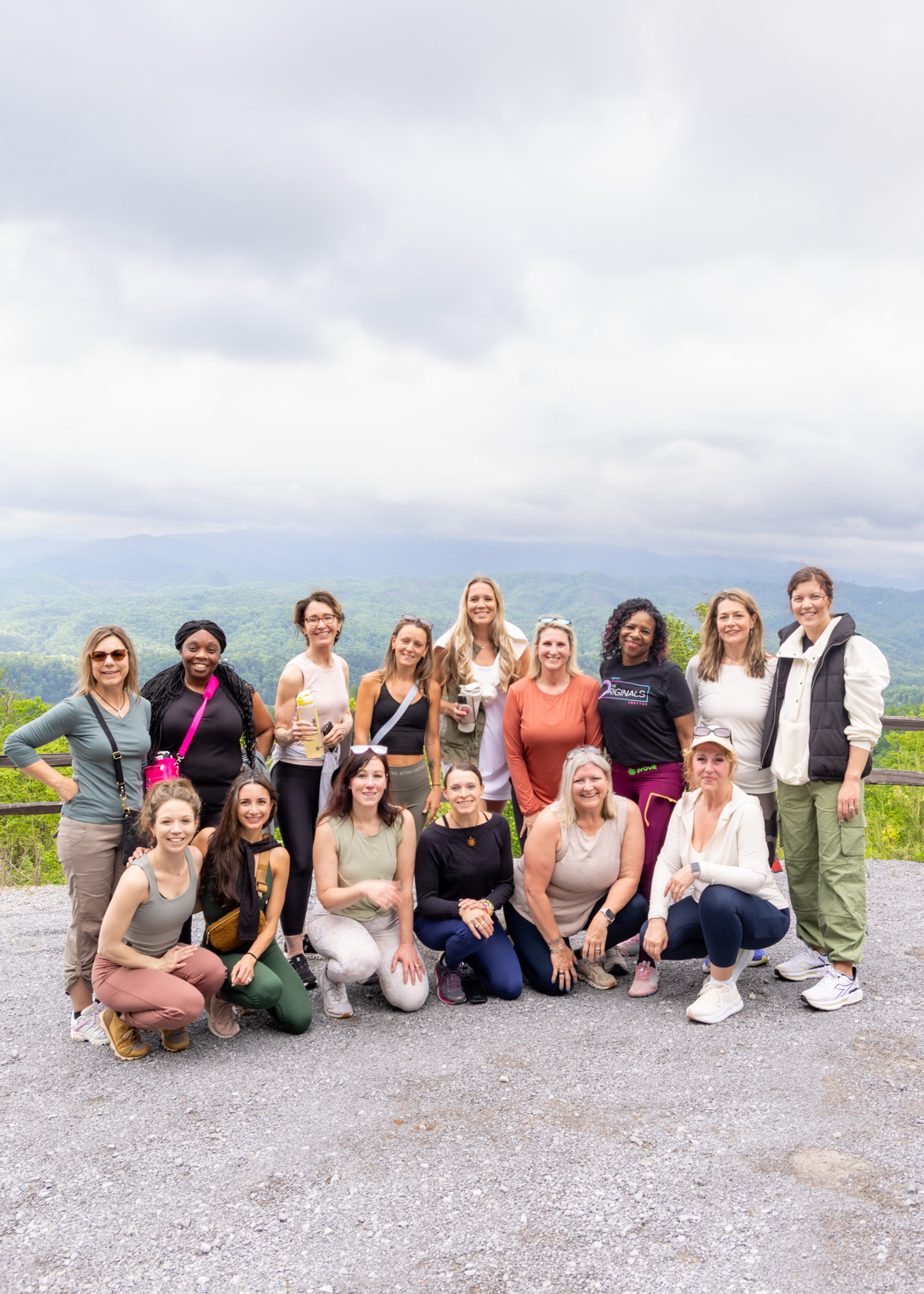 Momentum Pro teammates gathered outdoors with a mountain view