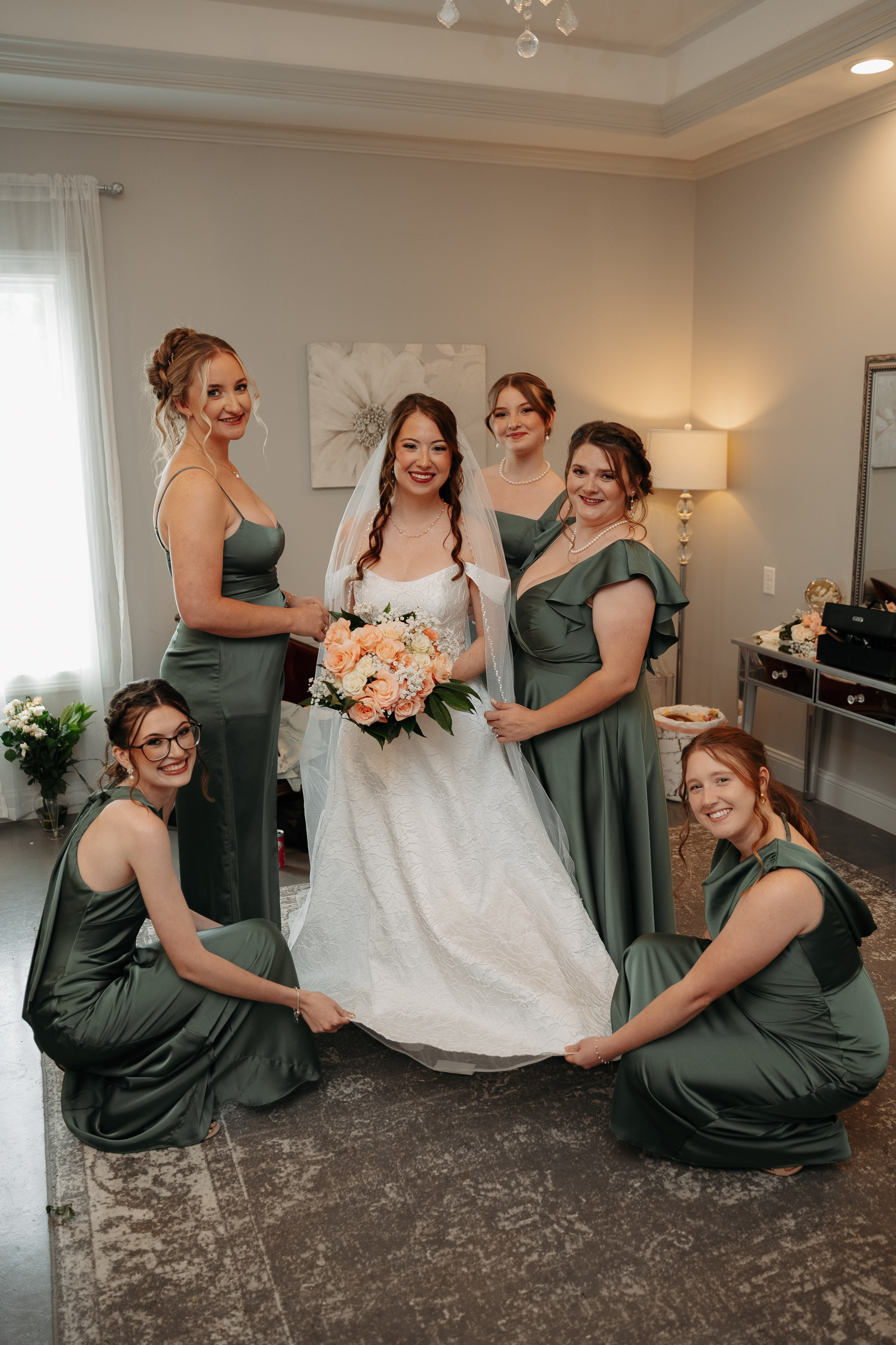 Bride with her bridesmaids in sage green